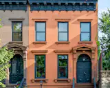The Brownstone Boys punched up this Stuyvesant Heights home with psychedelic wallpaper and jewel-toned paint while preserving its historic wood details.