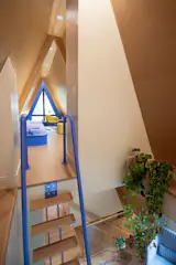 A ship’s ladder leads to the small loft at the top of the home.
