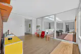 The interior flooring alternates between white oak and tile.
