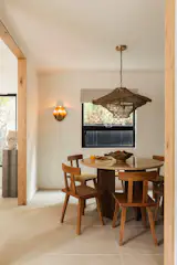 The home’s flooring consists of large-format tile and wire-brushed lager oak.