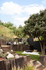 The edible garden is home to Japanese cucumbers, apples, peaches, and wild herbs.