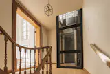 An elevator provides easy access to the home’s three levels.
