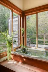 A soaking tub connects with an outdoor shower.