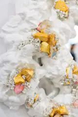The mirror’s frame is also made of industrial clay and gold leaf, and the overall effect is that of a melting Rococo-adjacent mirror, ripped from the walls of a little-used room in Versailles.