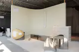 The booth for Interval, a design collective, featured work by Monica Sardo, Maurizio Bianchi Mattioli, Alban Roger, and Arthur Vallin, all rendered in hushed shades of cream and aluminum, and seemingly designed for a retrofuturistic office space where it is acceptable to smoke cigarettes indoors.