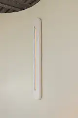Roger, who is responsible for the skinny and elegant sconce on the wall, said that all of the furniture was made in the Dominican Republic, hand-carved and shaped without the use of machines.