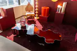 ...as well as the sinuous and pleasantly blobby coffee table by Bert Furnari. It’s made of hand welded-and bent powder-coated aluminum and has a commanding presence despite its low profile.
