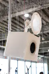 Coated in silicone that’s stretched over the contours of the hardware underneath and hung from the ceiling by hooks used for body suspension, the speakers actually looked (and felt) alive.
