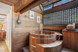 The Japanese-style soaking tub is constructed from red cedar.
