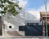 A designer and an art director create a laid-back family residence with three patios, a new level, and a combination of granite, wood, and metal.