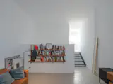Julian’s study sits a few steps below the second level, and has higher ceilings. An art director, he recently completed work on a popular Argentinian series called The Eternaut, streaming on Netflix.