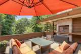 The middle level is home to a large terrace and the living room, kitchen, and office.