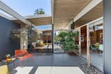 In classic Eichler style, a glass walled courtyard sits at the center of the home.