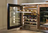 An undercounter wine cellar—such as this one by Dacor with an innovative GlideRack system for easy access—keeps favorite bottles at hand. Plus, its argon-infused Triple-Pane Glass Door protects your collection from UV rays and temperature fluctuations.