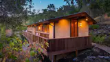 The home is set across just one floor, with a deck running the length of the structure.