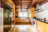 The updated kitchen, with Viking appliances, offers a counterpoint to the more traditional spaces that make up the rest of the home.