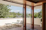 The balcony off the main room overlooks the San Gabriel Mountains.