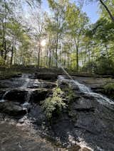 The 3.4 acre property is home to a rare feature in a city: a private waterfall.