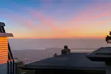 Situated on a hill, the deck provides glimpses of the Golden Gate Bridge through the fog.