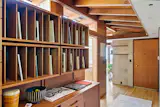 A vintage Cado wall unit by Poul Cadovius provides extra storage.