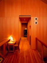 Upstairs, a Split lamp by <span style="font-family: Theinhardt, -apple-system, BlinkMacSystemFont, "Segoe UI", Roboto, Oxygen-Sans, Ubuntu, Cantarell, "Helvetica Neue", sans-serif;">Brooklyn designer </span><span style="font-family: Theinhardt, -apple-system, BlinkMacSystemFont, "Segoe UI", Roboto, Oxygen-Sans, Ubuntu, Cantarell, "Helvetica Neue", sans-serif;">Alvaro Ucha Rodriguez sits on a foldable desk that my great-grandfather used as a traveling minister.</span>