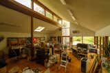 The large open room is currently in use as an artist's studio.