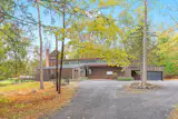 In Woodstock, a Curvy Home With a Far-Out Facade Seeks $3.5M - Photo 11 of 12 - 