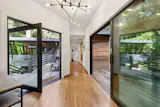 A narrow hallway, open to both the front and back patios, connects the addition to the original home.