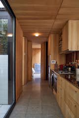 The second bedroom, used by Elena as a study, is down the hall, past the kitchen from the other bedroom.