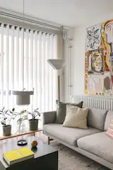 The sofa is joined by a Laine rug from Sera Helsinki, A805 and A201 lights from Artek, and a Kona side table from Ferm Living.