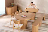 The Transformer Round dining table measures 45" L x 45" W x 30" H without any of the additional panels and when extended fully can seat 10 people. The bench has built-in storage for its unused panels, but the table doesn’t. Its three panels can be stored in the separate sideboard unit.