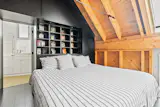 The lofted bedroom overlooks the common areas. 