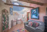 Circular skylights dot the ceiling, which is painted to look like the sky.