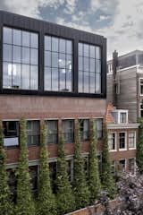 Vines were added up the side of the building. These naturally help cool down the building and on an aesthetic level, serve as a winding green beacon catching eyes at street level. For industrial buildings, that aren’t often all that welcoming and more or less categorically disconnected from nature, these interventions go a long way.