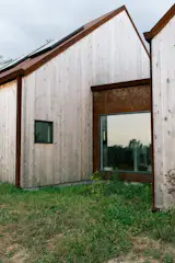 Per the agent, western red cedar and corten steel were "selected for their durability and graceful patina."