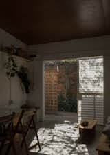 The slider at their entry provides different arrangements for privacy and ventilation: fully closed, light still penetrates the plastic panels; in the same position, the awning can be cracked for more air; fully open maximizes light and air, while welcoming engagement from neighbors.