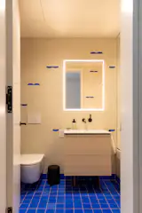 The kids’ bathroom features Zia Tile in Elemental Blue and fixtures from Rubinet and Duravit.