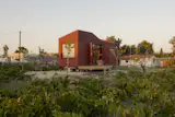 The 200-square-foot structure was built in Romania by Eco Tiny House and shipped to the island with furnishings and glazing already in place.
