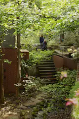 The couple took down boundary walls between the existing properties and created new pathways to connect them.