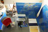 Jinnie works on large-scale artworks in her studio space.