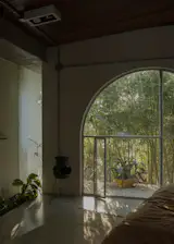 The custom door has a small hatch set at the floor to let in breezes.