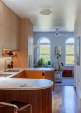 In the Bed-Stuy neighborhood of Brooklyn, Graci Mills, an architect and founder of Go Bang! Studio, and her partner Andrew Keck, an SNL prop master and founder of The Fabrication Shop, renovated a narrow and long two-bedroom apartment into a live-work space that balances privacy and openness.