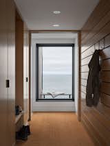 In the entry, a plush mat absorbs snow, sand, and mud. It was designed to be removable for cleaning or replacement.