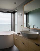 The primary bath combines Duravit fixtures with a Hydro Systems tub and Terra Maestricht tile by Mosa.