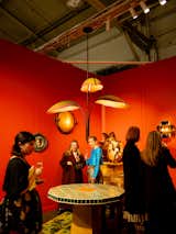 We particularly loved the bird-of-paradise leaf-shaped chandelier by New York–based studio Pelle placed above a forest-themed rug by Mexico City designer C.S. Valentin.