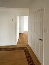 Before: Prior to renovating their Upper East Side penthouse, Daniel and Brianna Tsarevsky didn’t care for the floor designs, including a large compass-shaped inlay, that were apparent upon entering the unit.