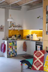 Barcelona architecture practice Lacol designed the co-op with attention to reducing energy costs. Instead of individual heating and air-conditioning systems, temperatures in the apartments and indoor common spaces are controlled via a radiant system.