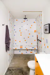 René arranged the bathroom tiling.
