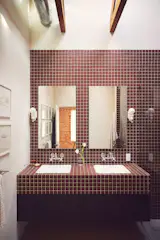 The bathroom walls and vanity are finished in Daltile Keystones porcelain tiles.