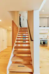 An inlay in the first tread of the stair commemorates the building’s update.